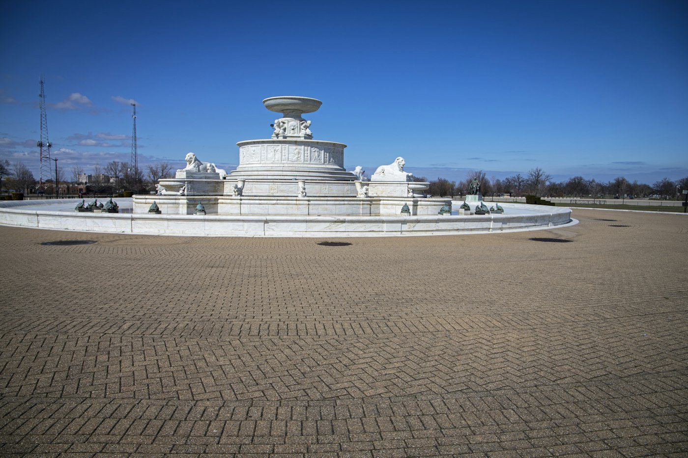 The white marble James Scott Memorial Fountain on Belle Isle under a clear blue sky